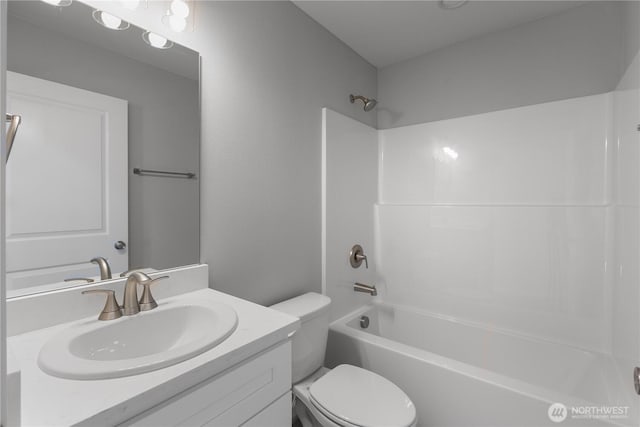 full bath with shower / bathing tub combination, vanity, and toilet