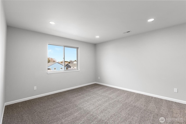 carpeted empty room featuring recessed lighting, visible vents, and baseboards