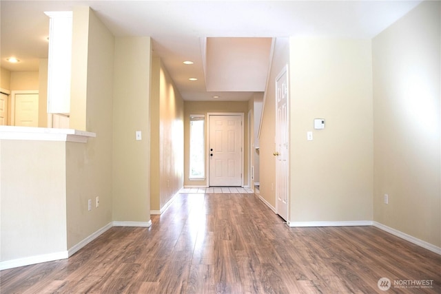 entryway with recessed lighting, baseboards, and wood finished floors