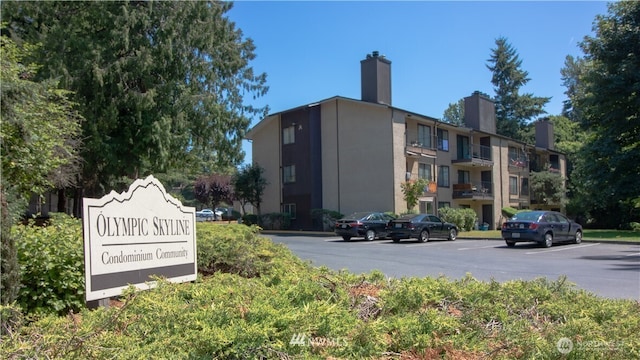 view of property featuring uncovered parking