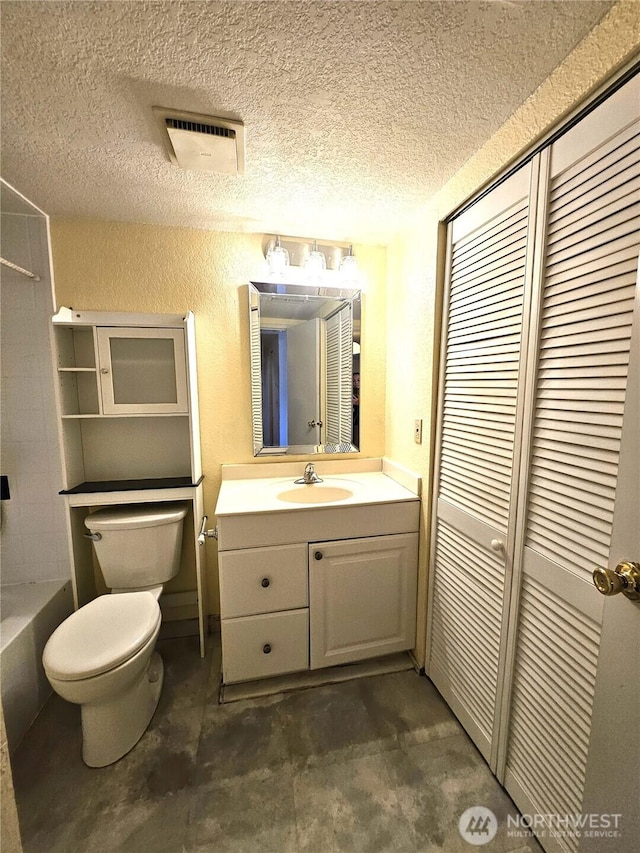 full bathroom featuring visible vents, toilet, a textured ceiling, vanity, and concrete flooring