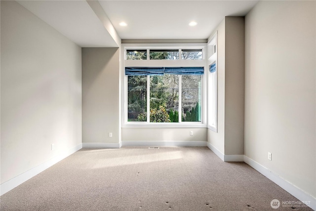 spare room featuring visible vents, baseboards, carpet flooring, and recessed lighting