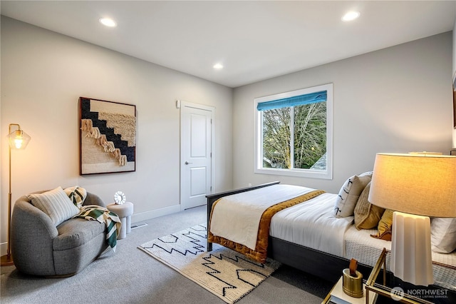 carpeted bedroom featuring recessed lighting and baseboards