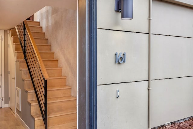 staircase featuring visible vents