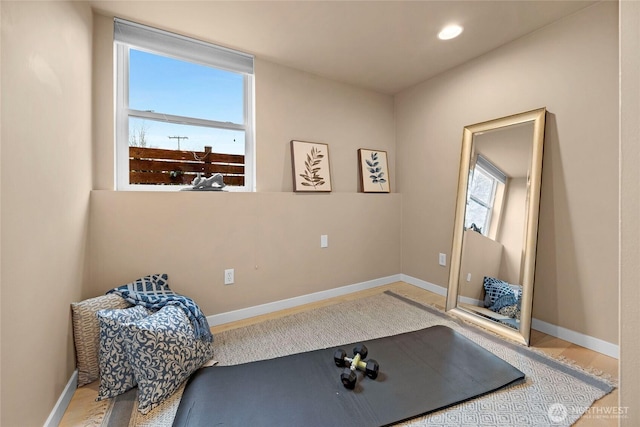 workout room with recessed lighting and baseboards