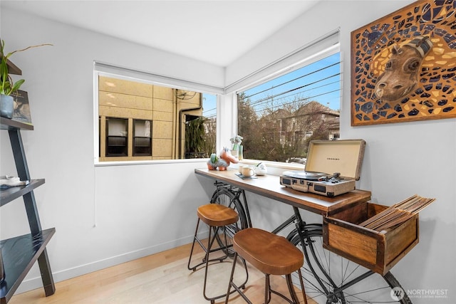 office area featuring wood finished floors and baseboards