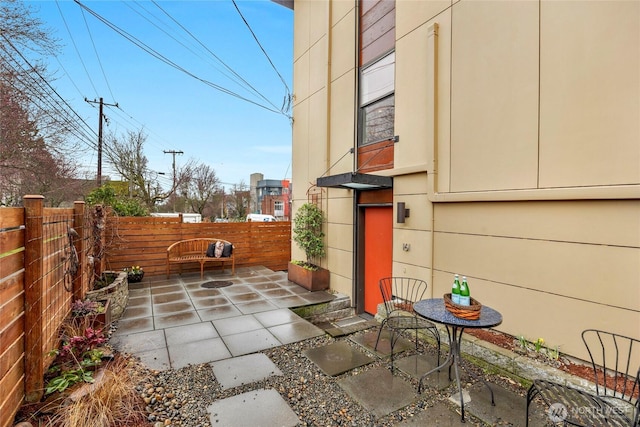 view of patio featuring fence