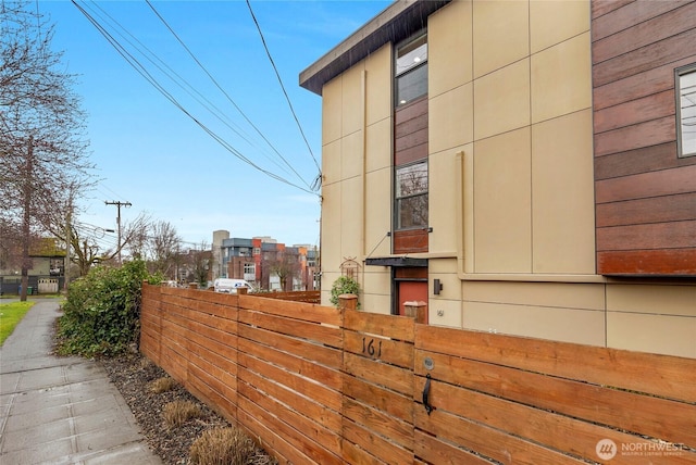 view of side of property with fence