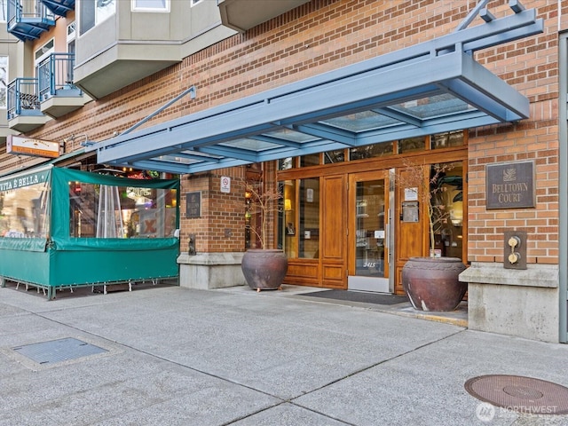 exterior space featuring brick siding