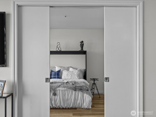 bedroom with wood finished floors