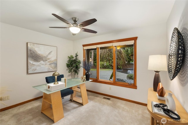 office space with light carpet, baseboards, and visible vents