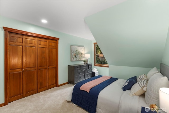 bedroom with light carpet, recessed lighting, and baseboards