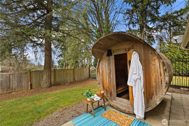 view of outbuilding with an outbuilding and a fenced backyard