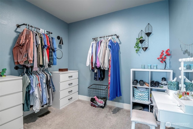 walk in closet with carpet and visible vents