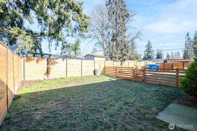 view of yard with a fenced backyard