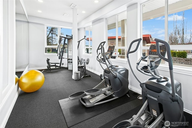 workout area with recessed lighting and baseboards