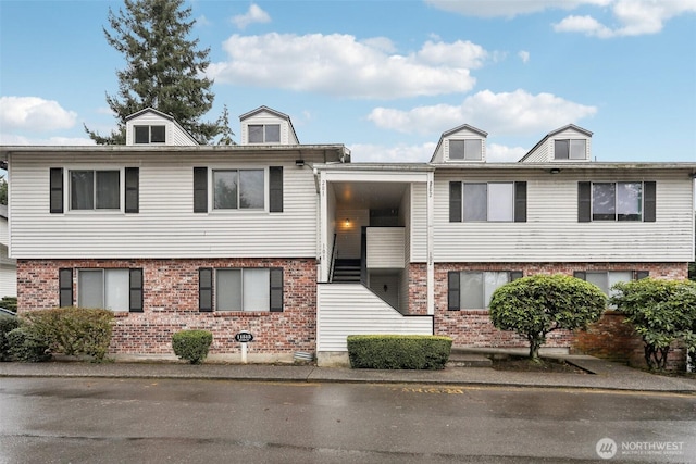 view of front of house with brick siding