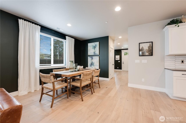 dining room featuring light wood-style floors, recessed lighting, and baseboards