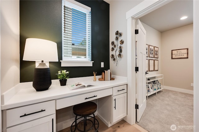 bathroom with recessed lighting and baseboards