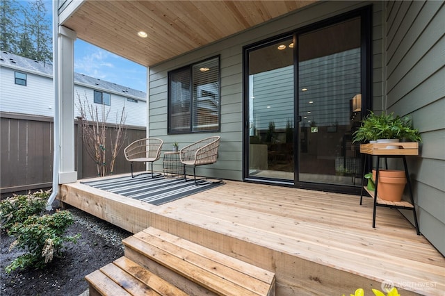 wooden deck featuring fence