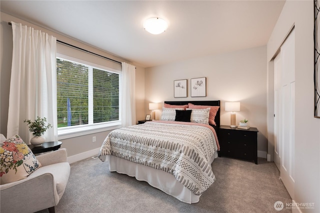 bedroom featuring a closet, carpet, and baseboards