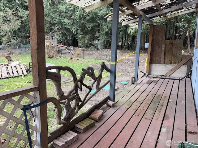 wooden terrace featuring fence