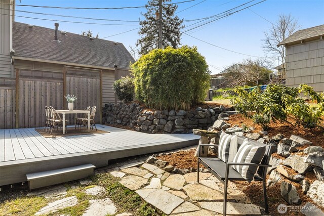 wooden deck with outdoor dining area