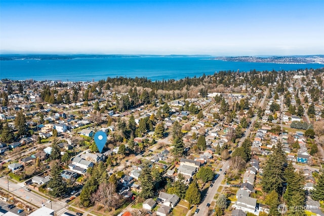 drone / aerial view featuring a water view and a residential view