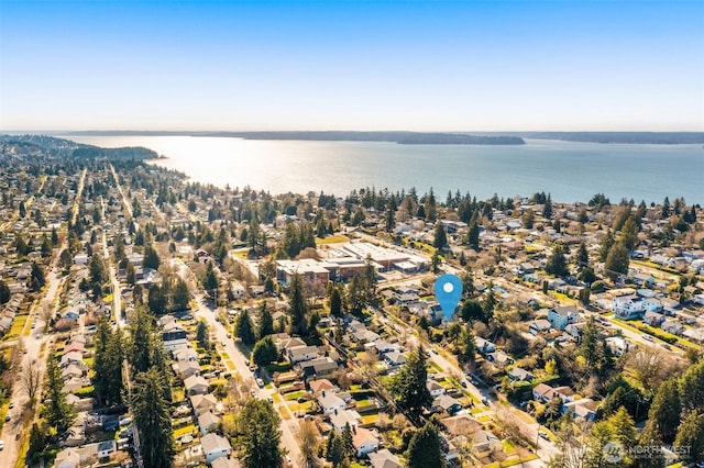 drone / aerial view featuring a residential view and a water view