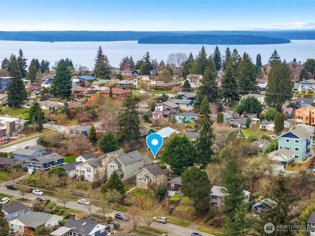 aerial view with a residential view and a water view