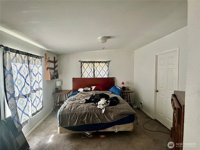 bedroom with carpet flooring and baseboards