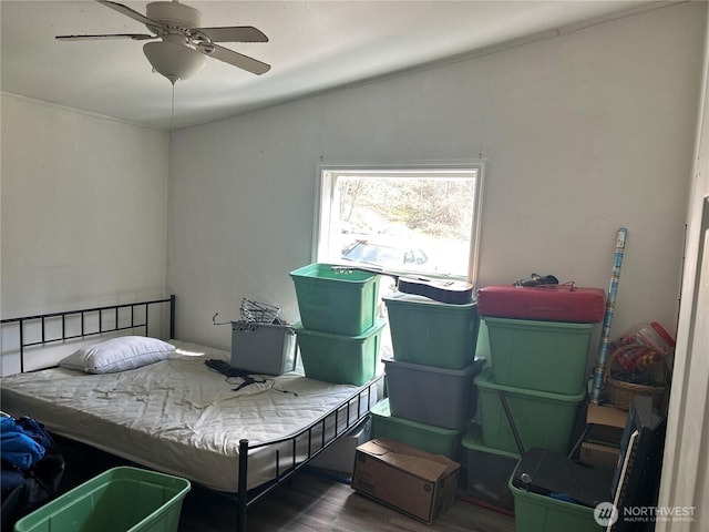 bedroom with a ceiling fan and wood finished floors