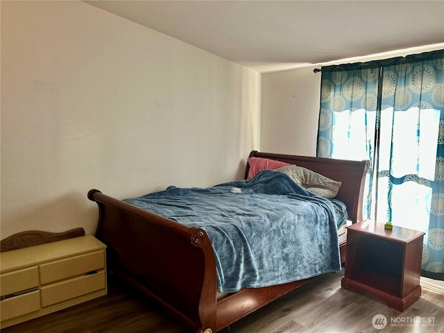 bedroom featuring wood finished floors