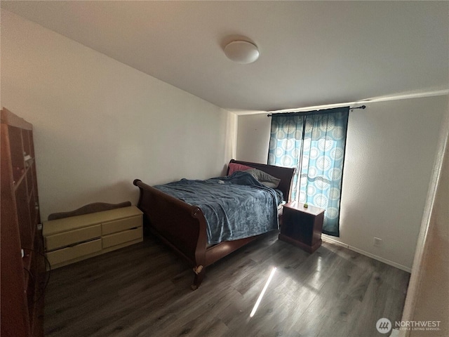 bedroom with wood finished floors