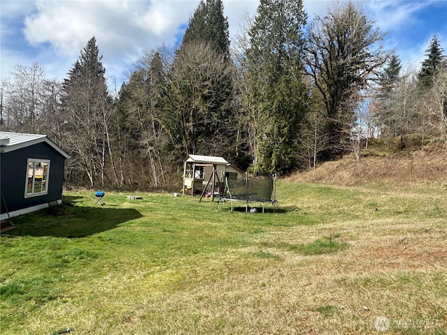 view of yard featuring a trampoline