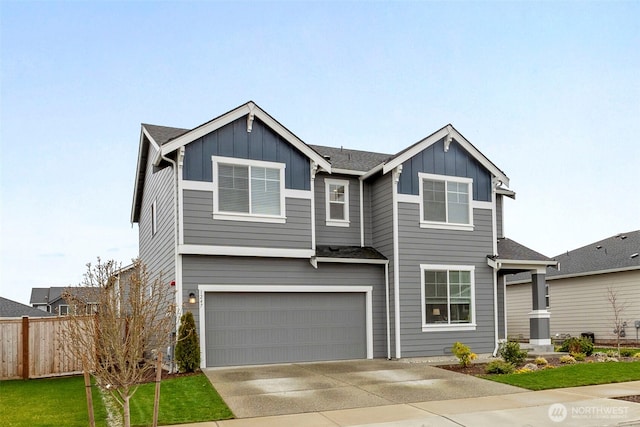 view of front of house featuring board and batten siding, a front lawn, fence, a garage, and driveway