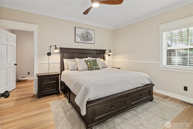 bedroom featuring visible vents, baseboards, light wood-style flooring, and ornamental molding