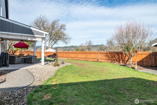 view of yard with a patio area, a fenced backyard, an outdoor living space, and central air condition unit