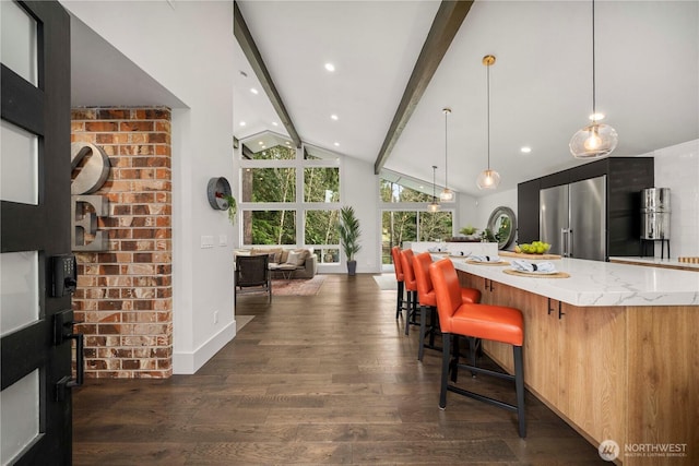 kitchen featuring modern cabinets, beamed ceiling, dark wood-type flooring, and high end fridge