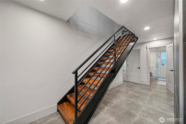 stairs featuring recessed lighting and baseboards