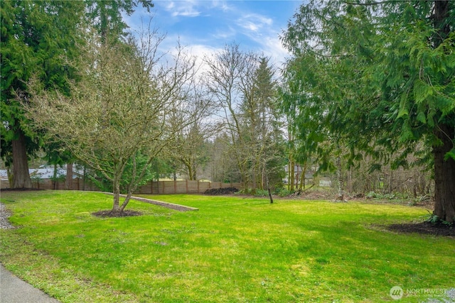 view of yard featuring fence