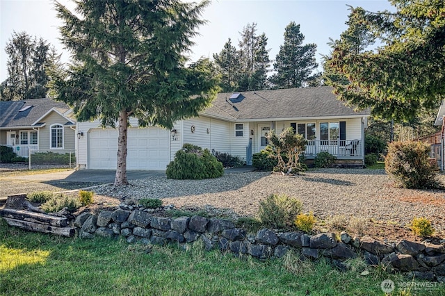 ranch-style house with a garage, covered porch, driveway, and a shingled roof