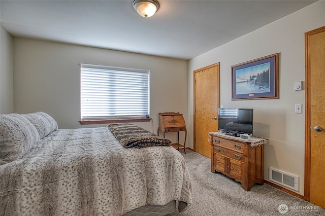 bedroom featuring light carpet and visible vents