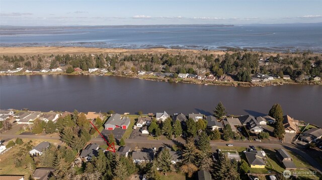 bird's eye view with a residential view and a water view