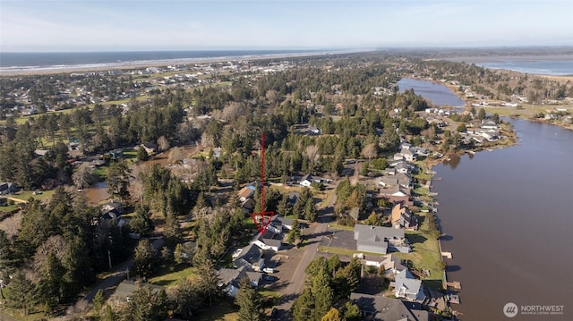 birds eye view of property with a water view