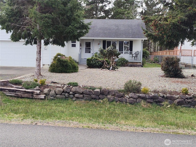 ranch-style house with a garage, a porch, concrete driveway, and roof with shingles