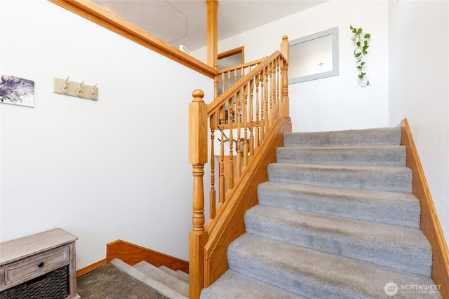 stairway featuring baseboards