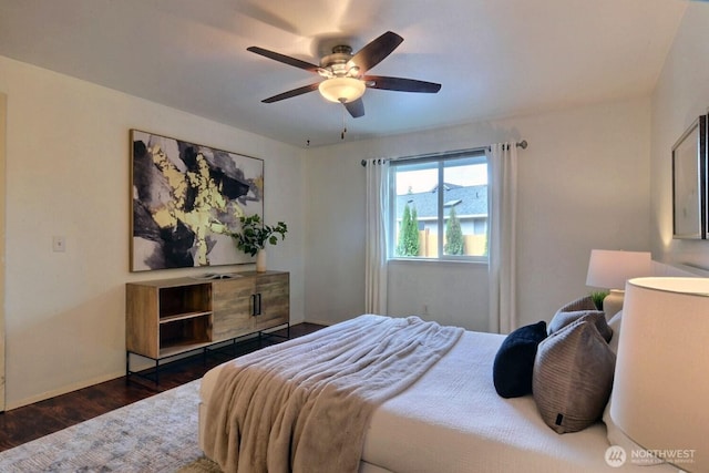 bedroom featuring dark wood-style floors, ceiling fan, and baseboards