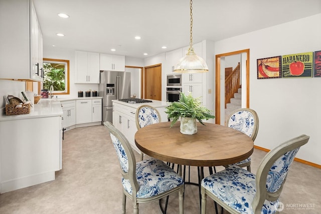 dining room featuring stairs, baseboards, and recessed lighting