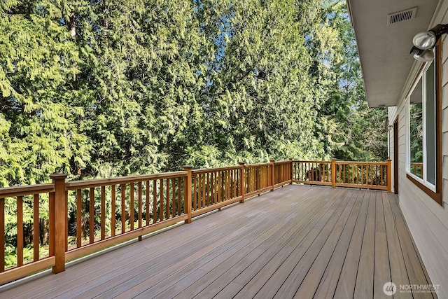 wooden deck with visible vents